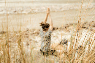 Person meditating on the beach