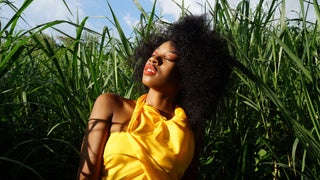 Woman in a field in sunlight