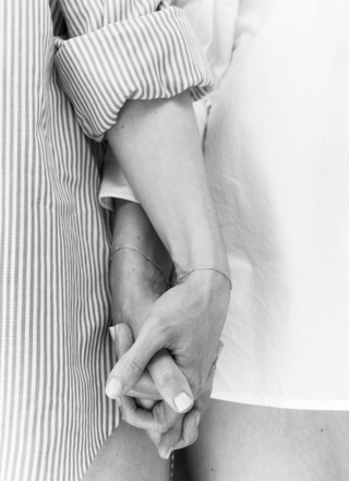 Sarah and Lauren holding hands