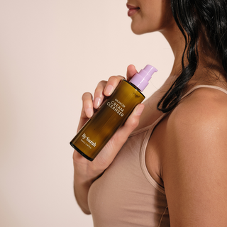By Sarah Balancer Cream Cleanser in hand