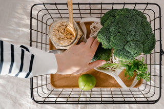 Basket of broccoli, oats and fresh produce