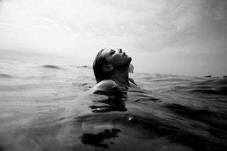 Person coming up out of sea for air