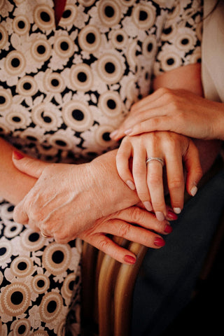 Mother and daughter holding hands